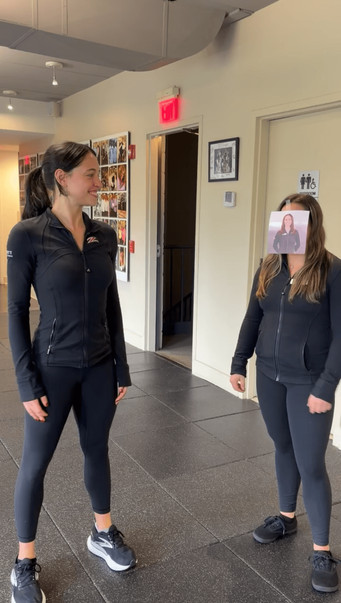 Physical therapist wearing a photo of a colleague’s face in a joke about choosing a physical therapist